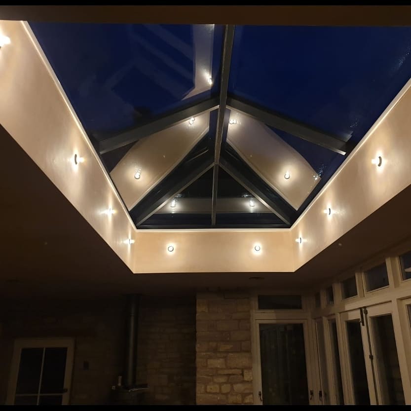 Roof lantern ringed with downlights at night